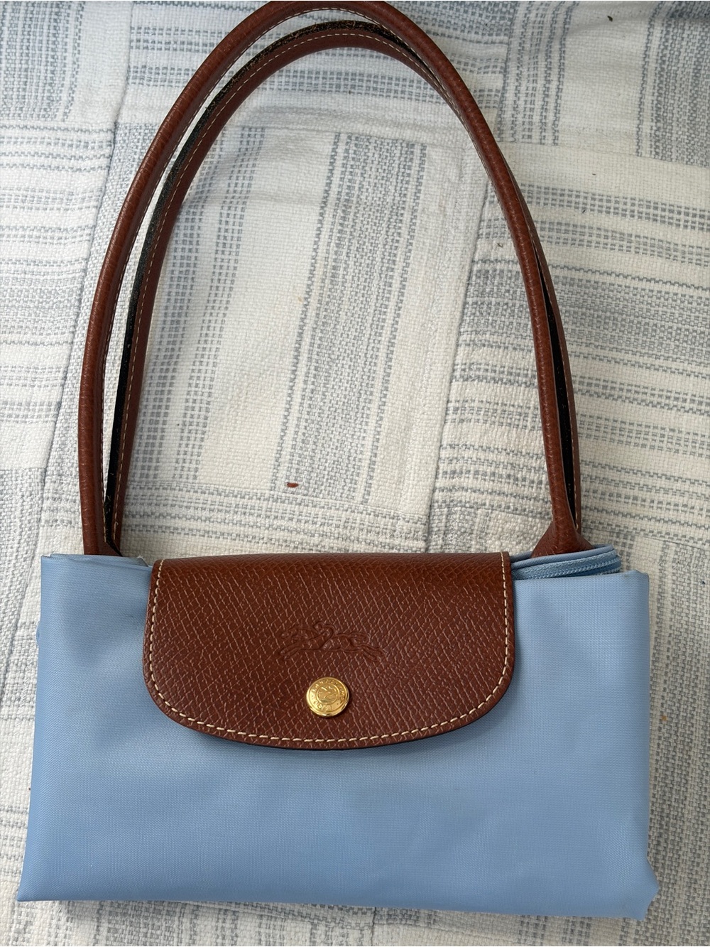 Longchamp satchel bag in light blue vinyl with brown leather trim